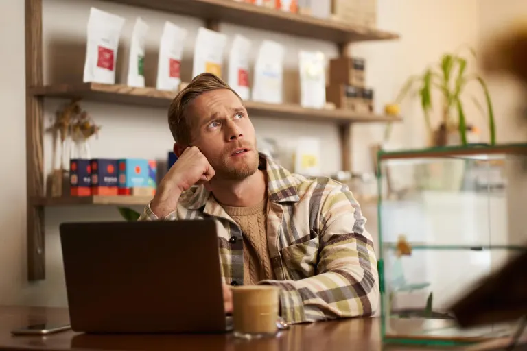 Business purchasing manager reviewing product orders, supplier costs and inventory requirements